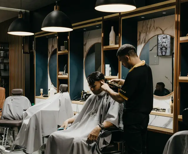 A barber cutting a client's hair