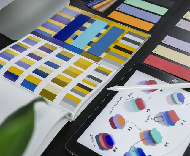 Color swatches and an iPad on a designer desk